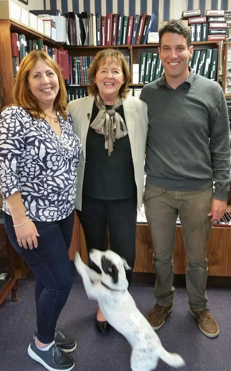 Caroline and Matt with a visitor in the shop